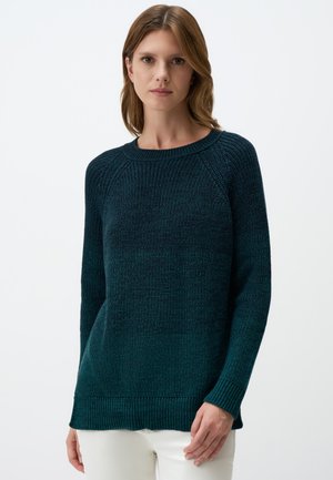 Dark teal knitted sweater with a round neckline, long sleeves, and ribbed hem. The texture is chunky and cozy, suitable for casual wear.