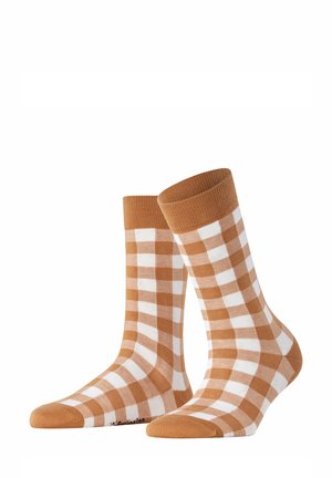 Chaussettes en coton à carreaux marron et blanc avec un haut côtelé et un orteil uni, de longueur moyenne et avec une texture lisse.