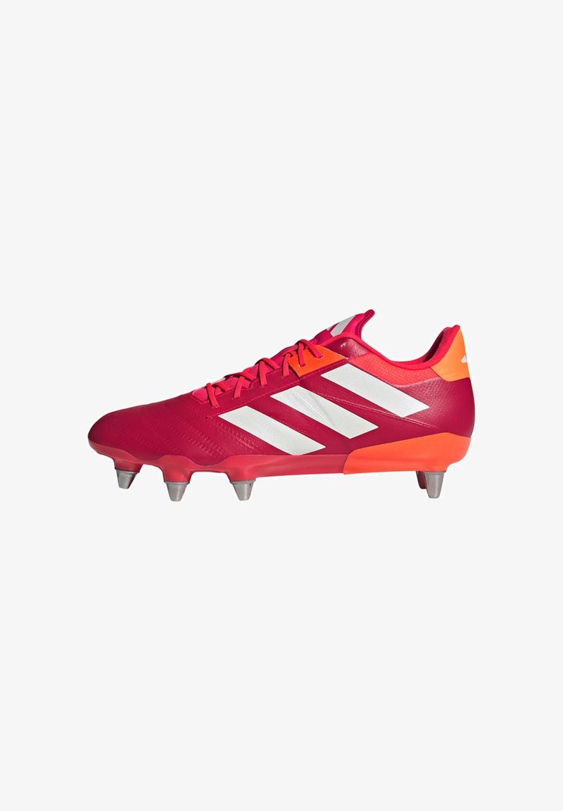 Red soccer cleat with white stripes, featuring a smooth synthetic upper, textured design, and orange accents on the heel. Six metal studs on the sole.