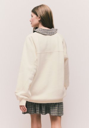 Next Športni pulover - ecru off white