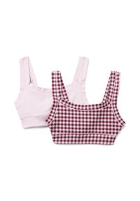 Due top crop: uno in un rosa chiaro solido, l'altro in un motivo a quadri bianco e bordeaux. Entrambi hanno spalline larghe e un design aderente.