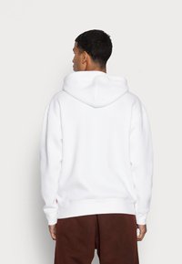 Levi's® RELAXD GRAPHIC HOODIE - Majica s kapuljačom - white