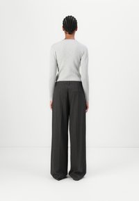 Copenhagen Muse TAILOR PANTS - Pantalon classique - black/red pear