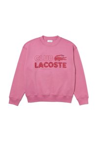 Sweat-shirt rose avec poignets et ourlet côtelés, arborant l'inscription « CLUB LACOSTE » en lettres texturées contrastées et un petit logo crocodile.