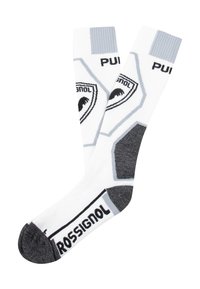Calcetines blancos hasta la rodilla con acentos grises y una marca, que presentan un diseño hexagonal y un refuerzo en el talón y la punta de color gris oscuro.