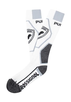 Chaussettes blanches montantes avec des accents gris et un marquage, présentant un design hexagonal et un renforcement au talon et à l'orteil de couleur gris foncé.