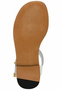 Suola in gomma marrone con scanalature texturizzate, con un accento nero. Fibbia decorativa in tono oro su cinturino sintetico bianco.