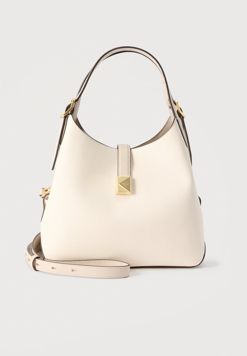 Τσάντα ώμου από ελεφαντόδοντο δέρμα με υφή χαλικιού, με πάνω λαβή, αποσπώμενο λουρί για τον ώμο και κλείσιμο με χρυσό κούμπωμα στο κέντρο μπροστά.