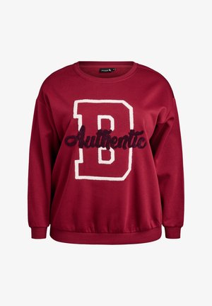 Burgundi värvi dressipluus ümara kaelusega, millel on suur valge täht "B" ja tekstuurse tumeda kirjaga sõna "Authentic". Kitsendatud varrukasääred ja alumine serv.