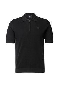 Svart polo skjorta med kort ärm och dragkedja i kragen, strukturerad stickad tyg, ribbade muddar och en cirkulär logotyp på bröstet.