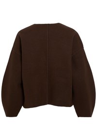 Rudas, trumpas megztinis, pagamintas iš švelnios vilnos, su laisvu siluetu, nuleistais petimis ir švaria, minimalistiška estetika. Turi centrines siūlės gale.