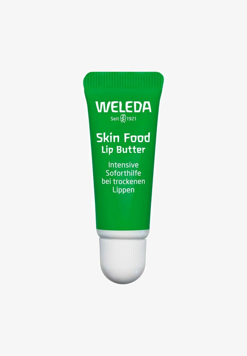 Green tube of Weleda Skin Food Lip Butter with white cap, featuring bold white text. Compact design for easy application of lip care.