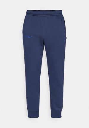 Námornícke modré teplákové nohavice vyrobené z bavlneného zmesi s elastickým pásom a manžetami, so smerom na stehno s modrým logom "CFC" a Nike.