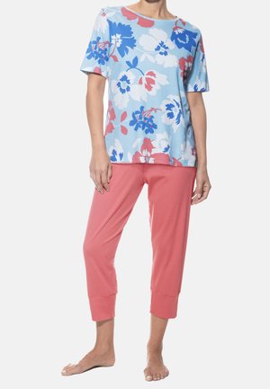 Floral print top in blue and pink, paired with coral cropped pants. Soft fabric with short sleeves, round neckline, and relaxed fit.