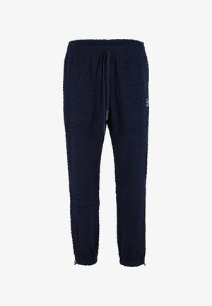 Pantaloni jogger bleu închis, cu textură, talie elastică, șnur și manșete elastice, cu un mic logo lateral.