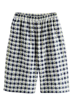Short à carreaux avec des carrés bleu marine et blancs ainsi que des rayures florales verticales jaunes, avec une ceinture élastique.