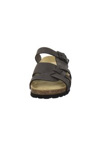 Brown leather sandal featuring crossed straps, buckle detail, cushioned footbed, and textured rubber sole for grip.