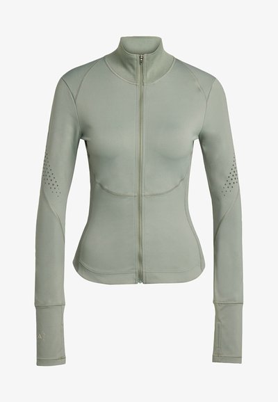 Light green athletic jacket with a high collar, full zipper, long sleeves, and perforated accents on shoulders. Made of stretchy fabric.