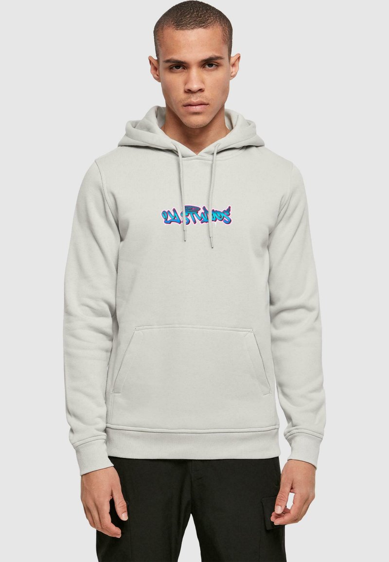 Light gray hoodie with a kangaroo pocket, drawstring hood, and multicolored graphic design in the center. Soft fabric texture evident.