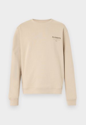 Sweat-shirt beige en coton, avec un col rond et des manches longues. L'avant affiche le logo "ALLSAINTS" en texte foncé.