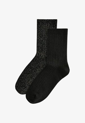 Black socks set: one with a solid texture and the other with a glittery pattern. Both have a mid-calf length and ribbed cuffs.