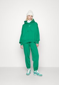 Nike Sportswear W PHNX FLC HR OS - Calças de fato de treino - malachite