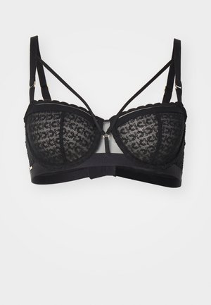 Schwarzer Spitzen-Bralette mit gewellten Kanten, ausgestattet mit filigranen Mustern, verstellbaren Trägern und goldenen Hardware-Elementen. Weicher Stoffbasis.