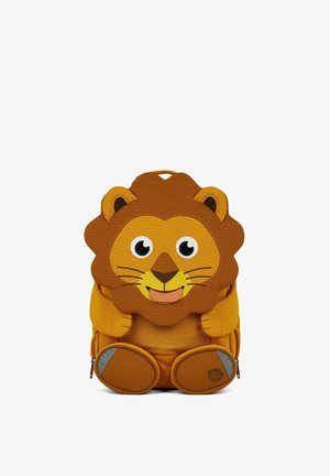 Children's backpack shaped like a smiling lion with a brown mane, yellow face, and round feet with reflective patches.