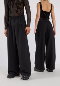 YOURTURN UNISEX - Tygbyxor - black