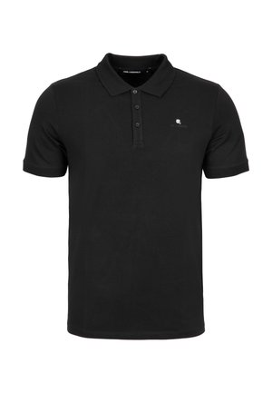 Svart polo-shirt i bomull, med en placket med tre knappar, korta ärmar och en diskret logotyp på vänster bröst.