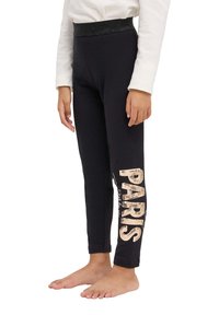 Leggings neri con fascia brillantinata, caratterizzati da una grande stampa "PARIGI" in paillettes dorate sulla gamba sinistra. Tessuto morbido, vestibilità aderente.