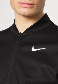 Nike Golf REPEL TOUR MIX PKBL  - Sportinė striukė - black white