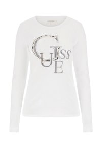 Biała koszulka z długim rękawem z dużym logo zrobionym z srebrnych ćwieków, okrągły dekolt i dopasowany krój. Gładki materiał bawełniany.