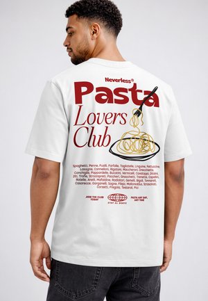 Man wearing white T-shirt with red text "Pasta Lovers Club" and spaghetti illustration on back with pasta names listed below.