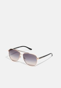 Pilotensonnenbrille mit einem Rahmen aus Roségold-Metall, grauen Verlaufslinsen und schwarzen Kunststoffbügeln, die auf der Außenseite ein dezent platziertes Logo aufweisen.