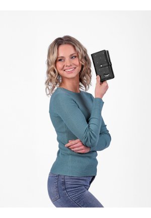 Black wallet with a smooth texture and small gold accents, held by a person wearing a teal ribbed sweater, against a white background.