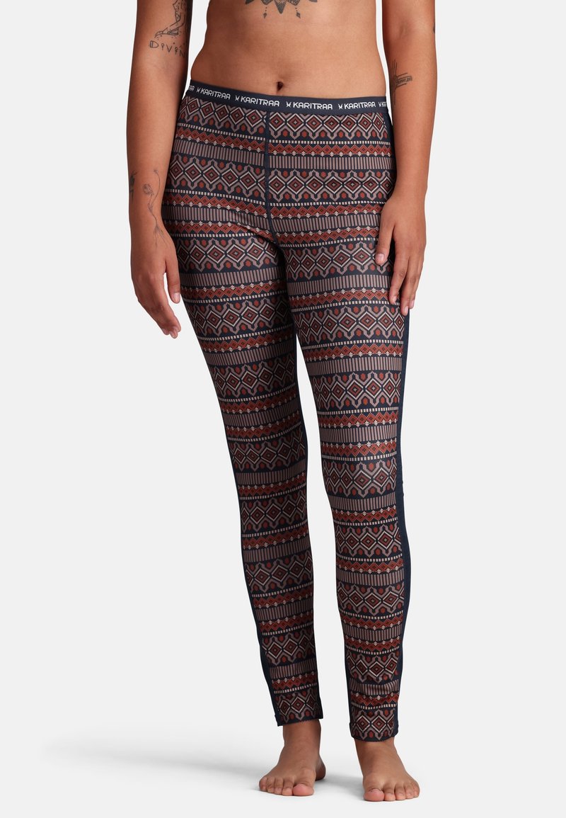 Leggings i ett flerfärgat geometriskt mönster med röd och blå färg, tillverkade av elastisk tyg, med en smidig midja och en åtsittande design.