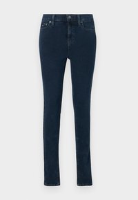 Dark blue denim jeans, slim fit, with a mid-rise waist, front pockets, and a small logo detail on the back. Standard stitching and hem.