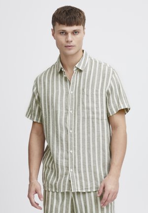Short-sleeve button-up shirt in a light green and white vertical stripe pattern, featuring a chest pocket and a relaxed fit.