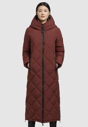 Long, burgundy quilted puffer coat with a hood, featuring a front zipper and side pockets, made of smooth, insulated fabric.