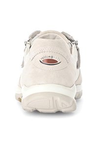 Beige suede sneaker with metallic accents, zipper closure on the side, and a white rubber sole featuring a textured pattern.