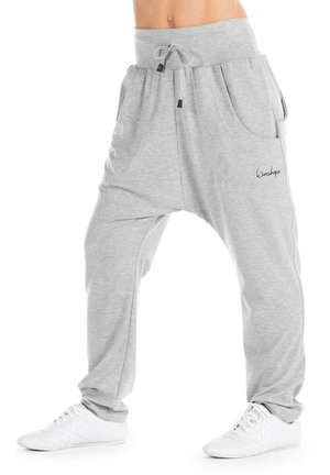 Lichtgrijze harem pants gemaakt van zachte stof, met een brede tailleband, trekkoord en zijzakken voor een comfortabele en ontspannen pasvorm.