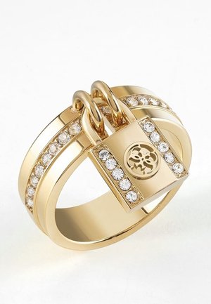 Gold ring with embedded clear stones, featuring a decorative padlock with clear stones and a circular floral design in the center.
