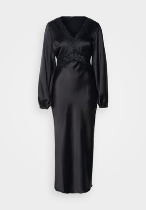 Fekete szatén ruha hosszú ujjakkal, V-nyakkivágással, csipke díszítéssel a deréknál és a nyakkivágásnál. Simaságú textúra, testhez simuló sziluett.