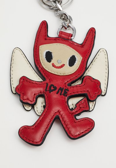 Red leather keychain shaped like a cartoon character with white wings, black accents, and the text "LO♡E ME" on its body.