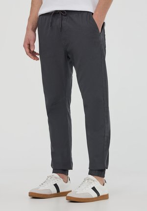 JOGGER WITH DRAWSTRING AND CUFFS - Pantaloni sportivi - canna di fucile