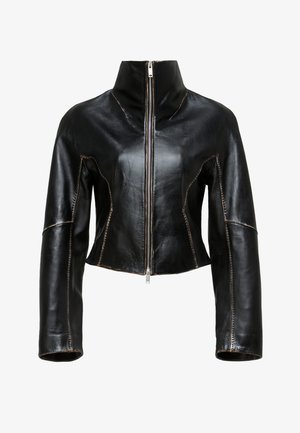 Black leather cropped jacket with a high collar, front zipper closure, and contrasting beige stitching along the seams.