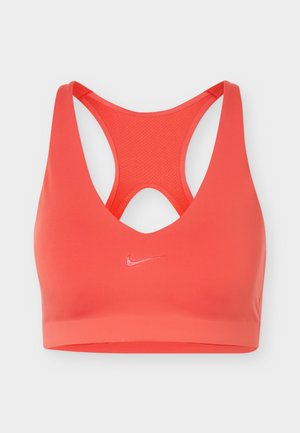 Κόκκινο αθλητικό σουτιέν με σχεδίαση racerback και μικρό λογότυπο Nike στη μέση μπροστά.