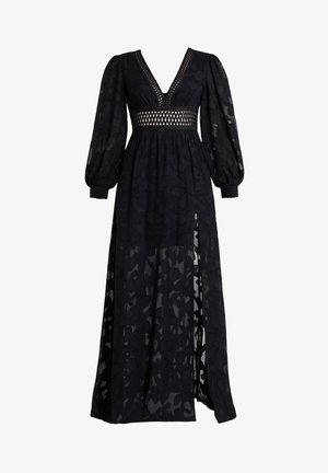 Czarna maksiforma z dekoltem w kształcie litery V, prześwitującym kwiatowym wzorem, bufiastymi rękawami, wycięciem w talii oraz rozcięciem z boku.
