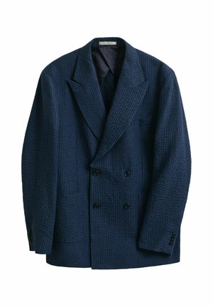 Marineblauer, doppelt geknöpfter Blazer aus strukturierter Stoff mit breiten Revers, ausgestattet mit vier Knöpfen vorne und geknöpften Manschetten.